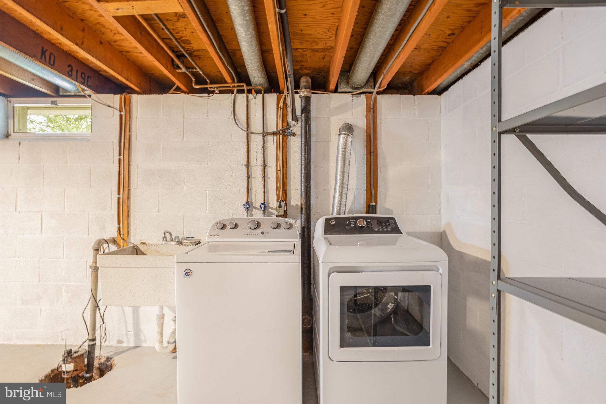 10509 Longbranch Road Cockeysville, MD 21030 - Photo 31 of 38 a kitchen with a sink a stove and a refrigerator
