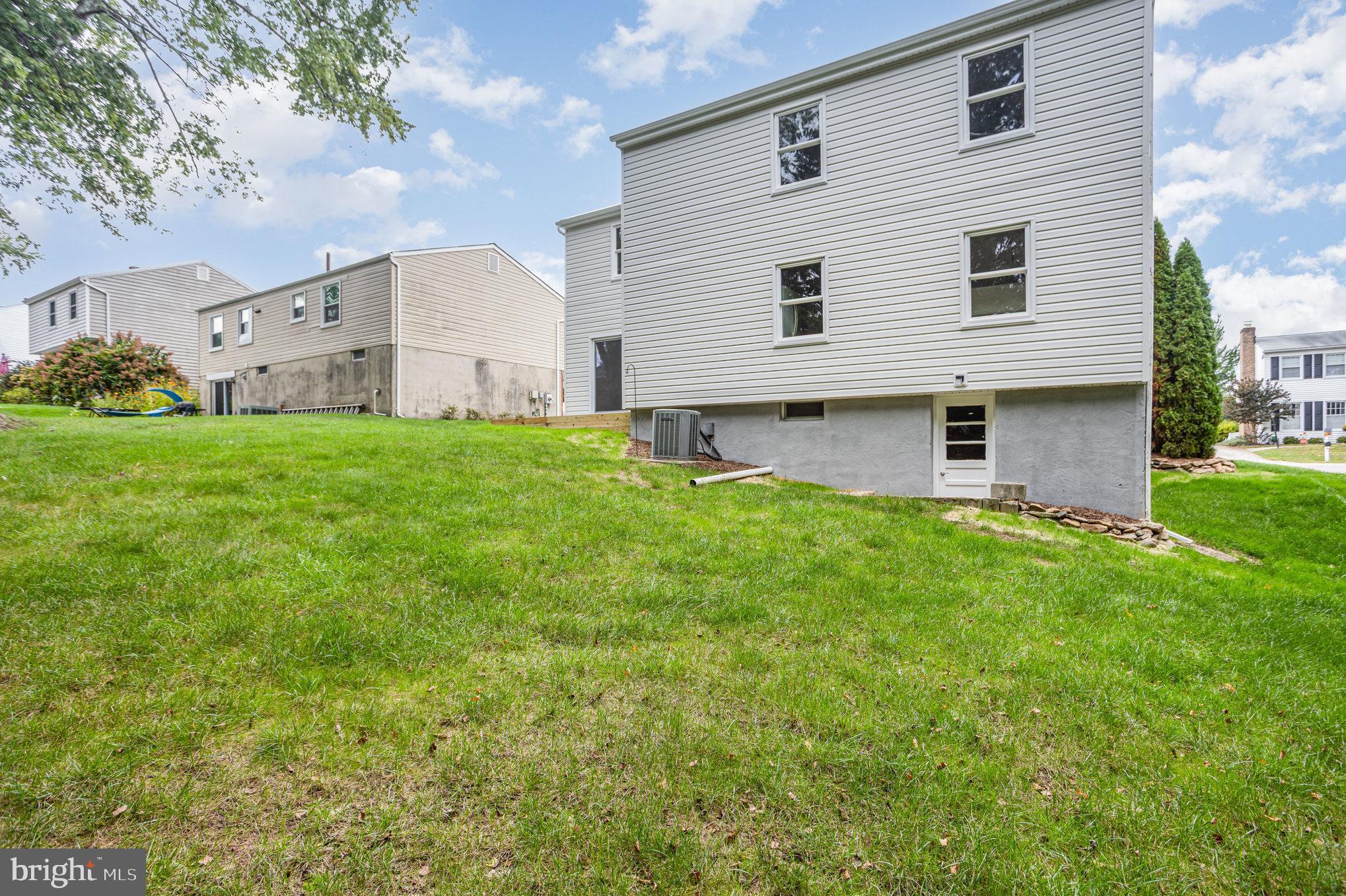 10509 Longbranch Road Cockeysville, MD 21030 - Photo 35 of 38 a front view of house with yard and seating area