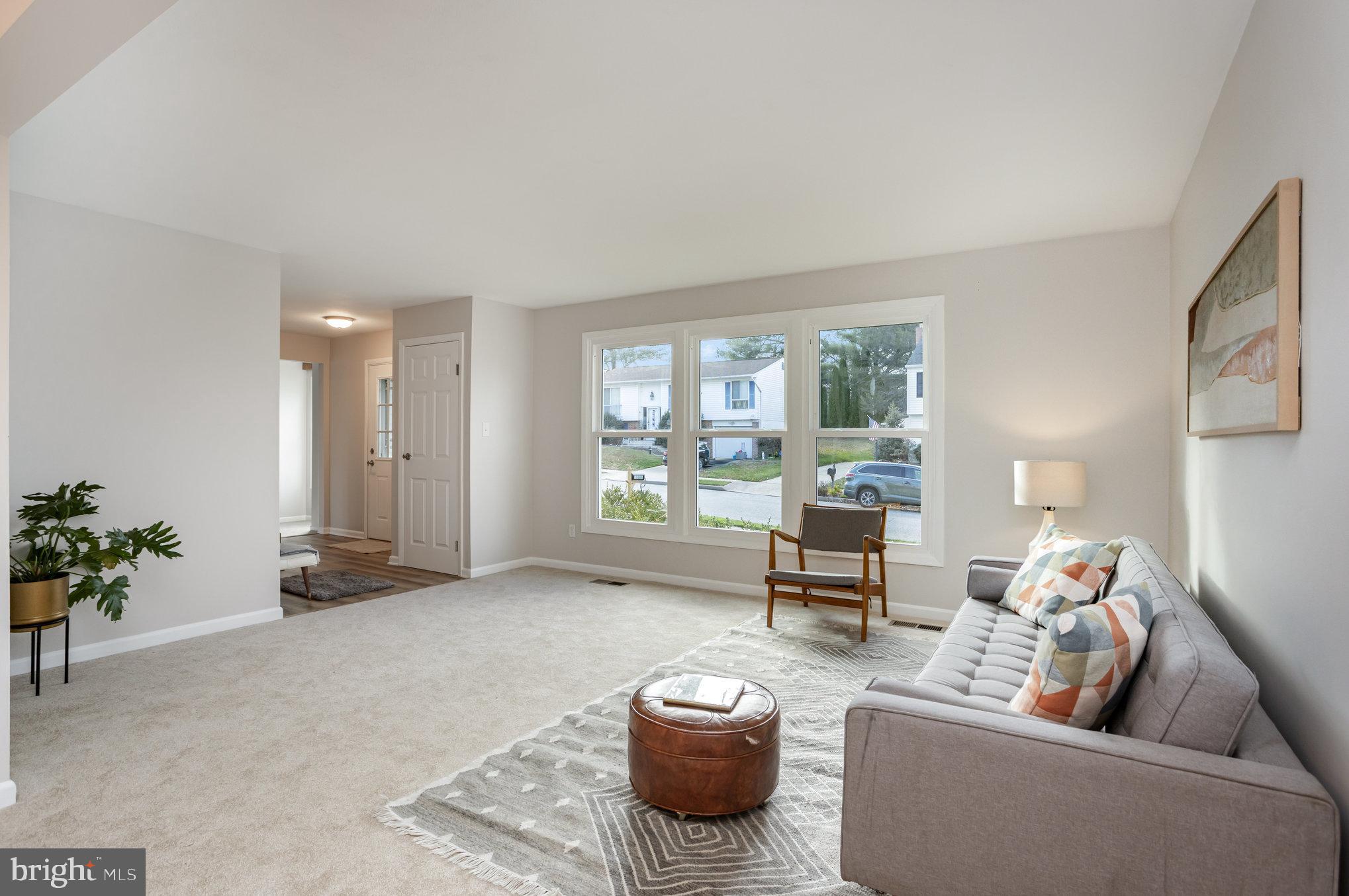 10509 Longbranch Road Cockeysville, MD 21030 - Photo 5 of 38 a living room with furniture and a large window