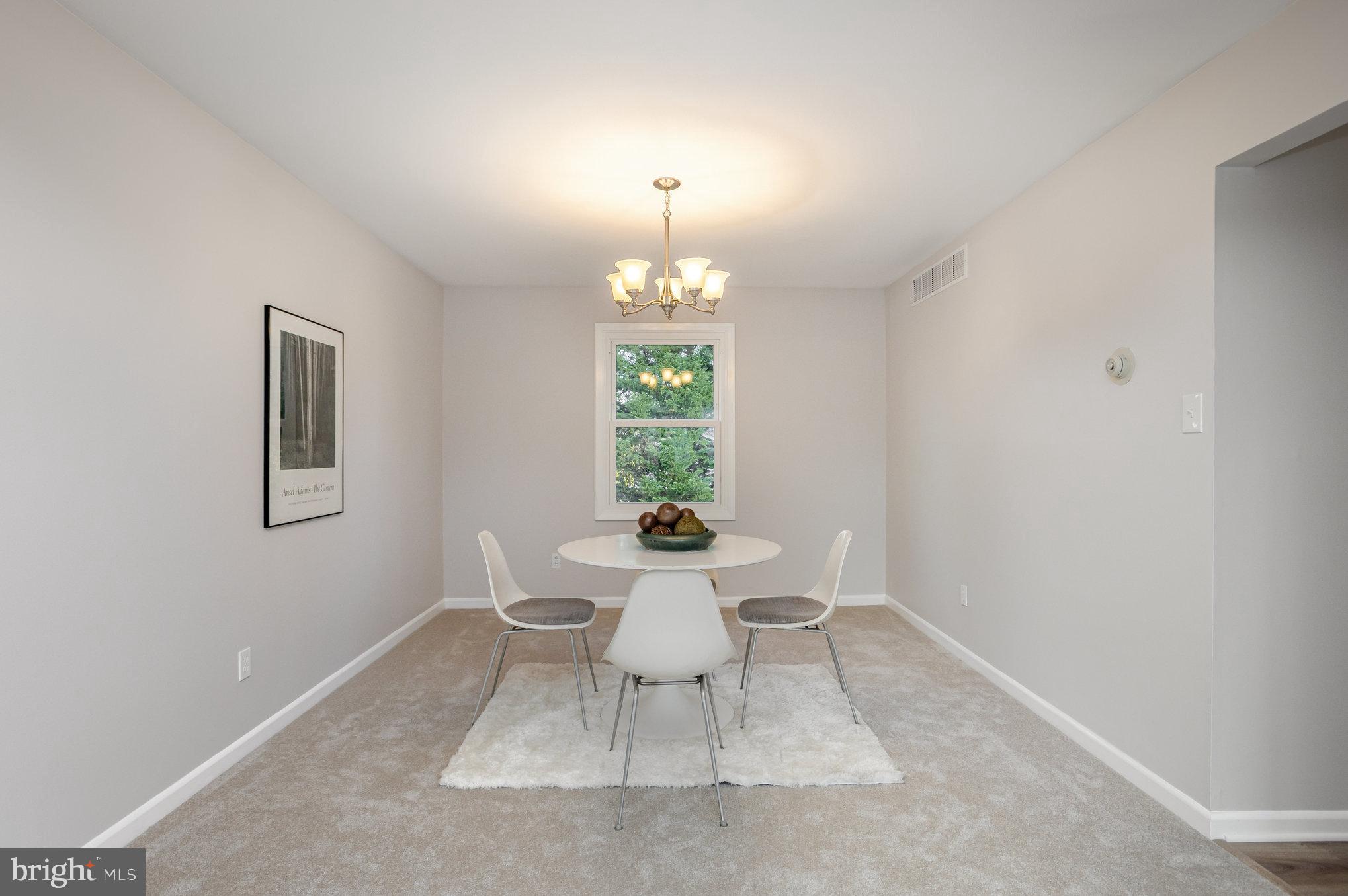 10509 Longbranch Road Cockeysville, MD 21030 - Photo 8 of 38 a dining room with a window and chairs