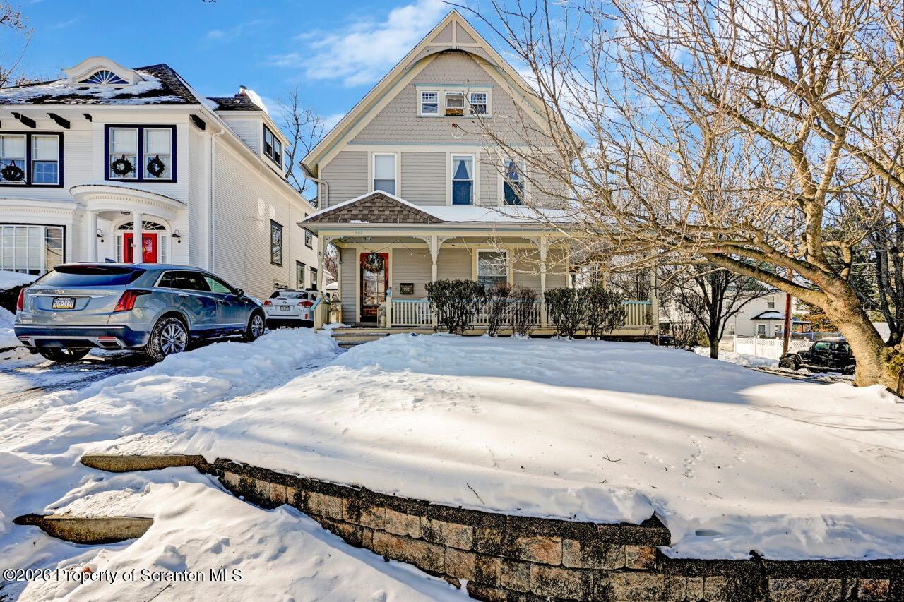 902 Columbia Street Scranton, PA 18509 - Photo 1 of 66 a view of multiple houses with a yard