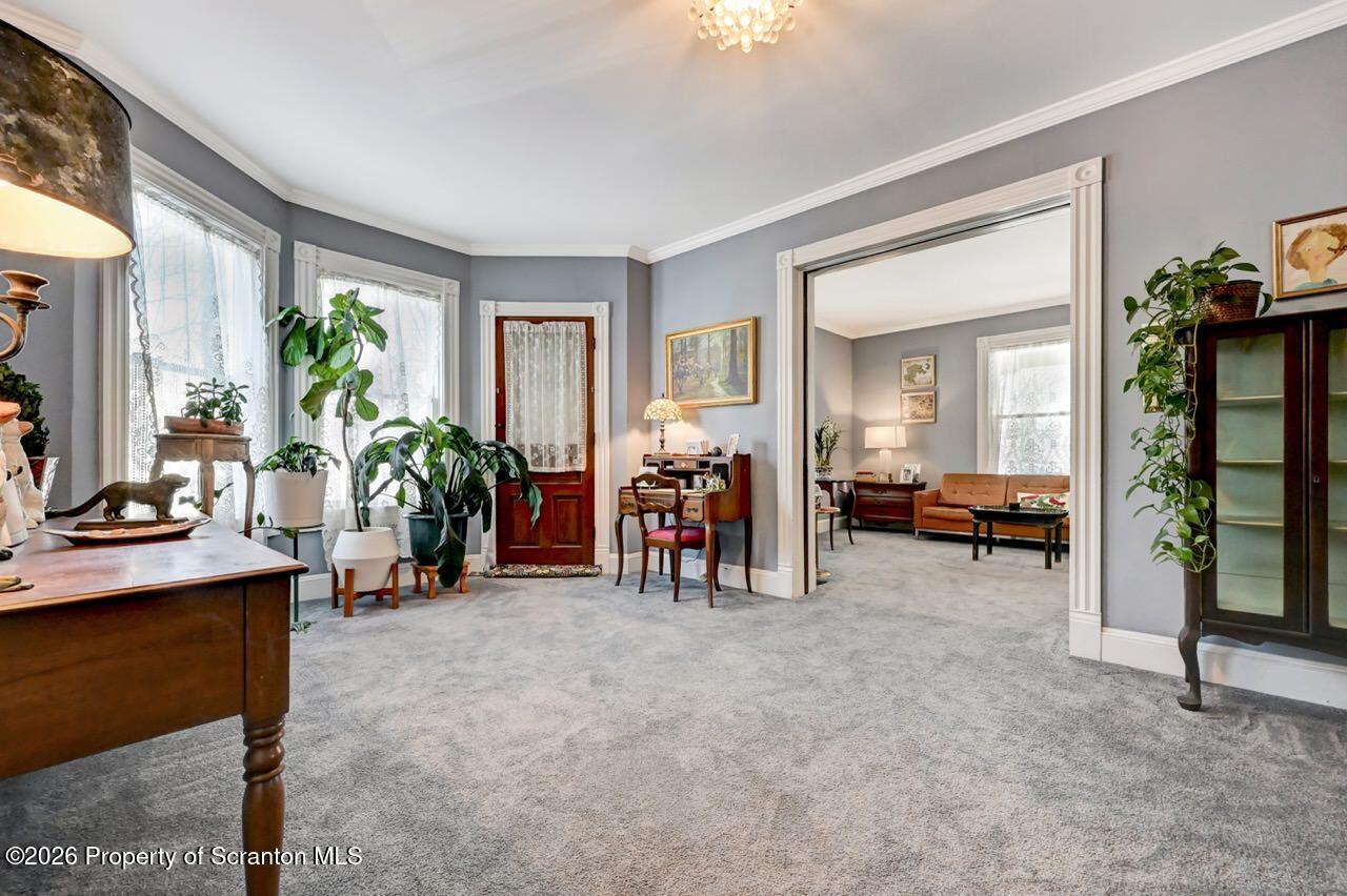 902 Columbia Street Scranton, PA 18509 - Photo 14 of 66 a living room with furniture and a potted plant