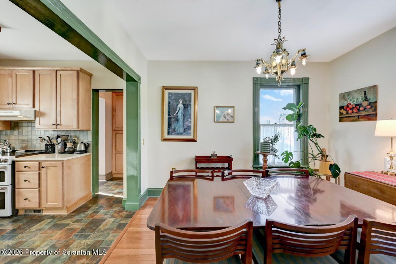 902 Columbia Street Scranton, PA 18509 - Photo 18 of 66 a living room with dining table and a chandelier