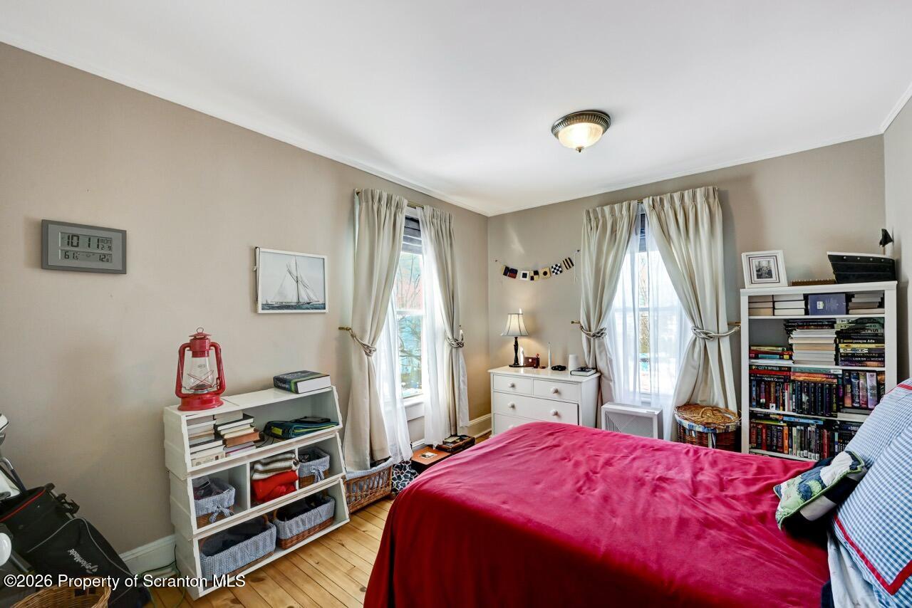 902 Columbia Street Scranton, PA 18509 - Photo 37 of 66 a bedroom with a bed and a book shelf