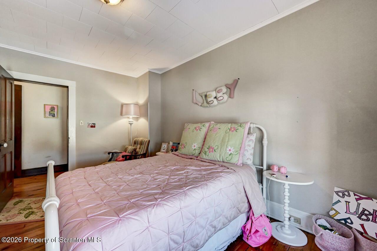 902 Columbia Street Scranton, PA 18509 - Photo 43 of 66 a bed room with a bed and a couch
