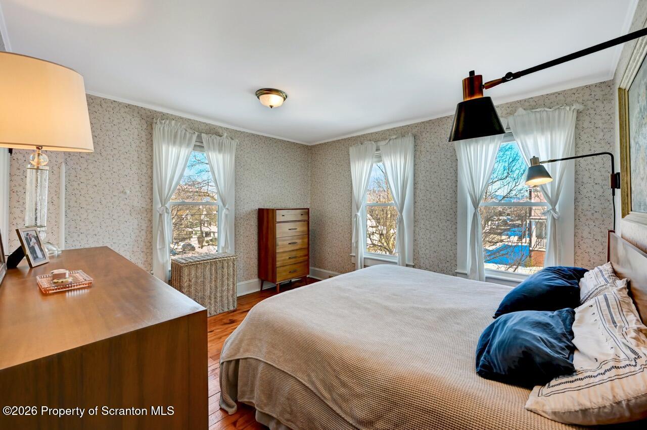 902 Columbia Street Scranton, PA 18509 - Photo 48 of 66 a bedroom with a bed and a flat tv screen on dresser