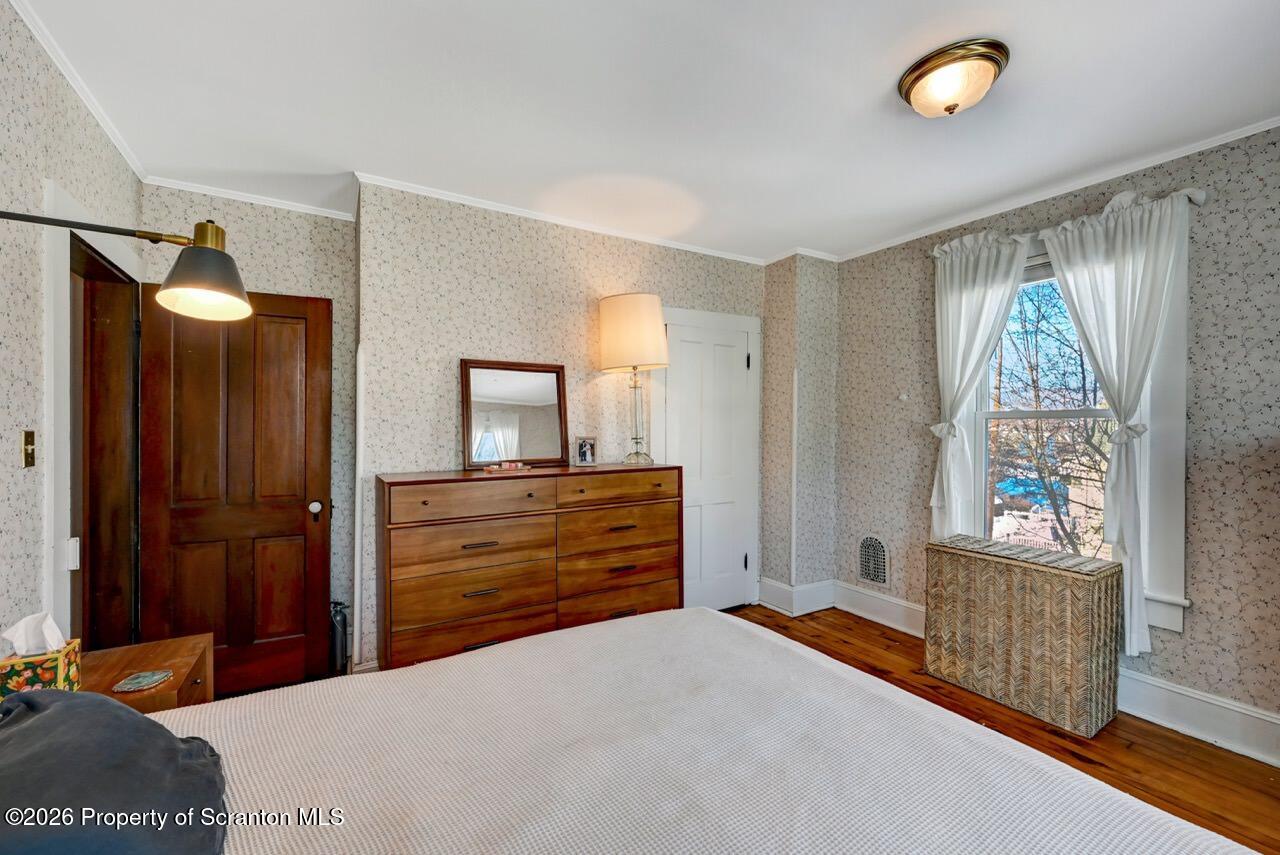 902 Columbia Street Scranton, PA 18509 - Photo 51 of 66 a bedroom with a bed and a dresser