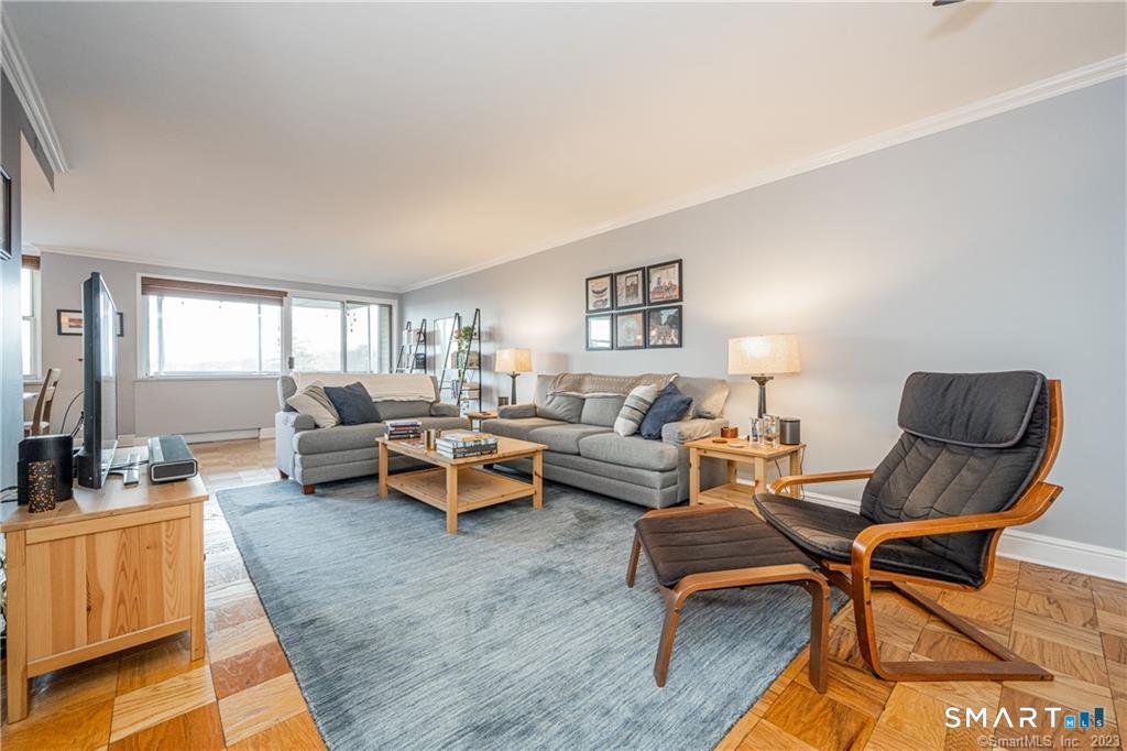50 Glenbrook Road, Unit 6E Stamford, CT 06902 - Photo 3 of 18 a living room with furniture and a rug