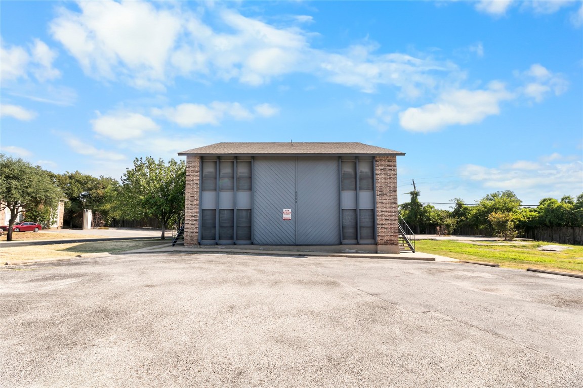 4304 Acropolis Court, Unit B Austin, TX 78759 - Photo 17 of 22 a house view with a big yard