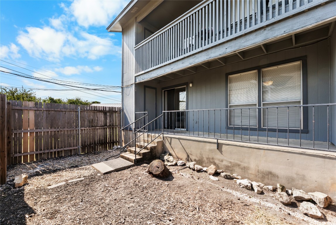 4304 Acropolis Court, Unit B Austin, TX 78759 - Photo 20 of 22 a view of a backyard with a wooden fence