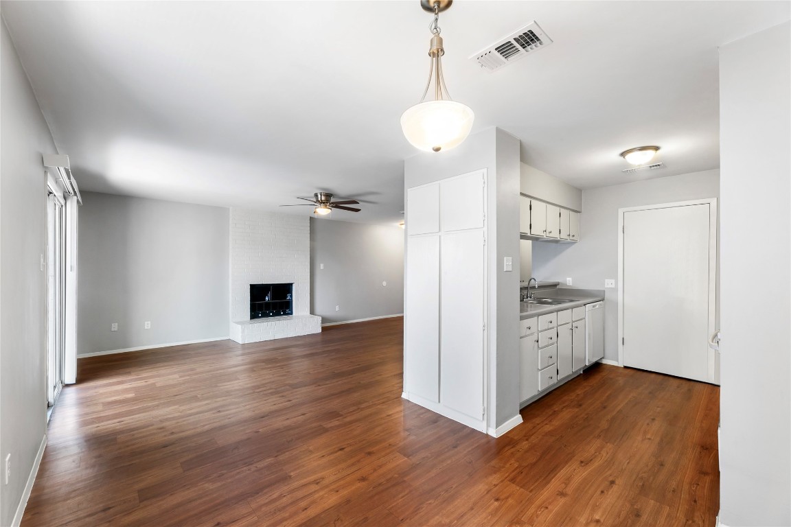 4304 Acropolis Court, Unit B Austin, TX 78759 - Photo 3 of 22 a view of a kitchen with a refrigerator and a stove top oven