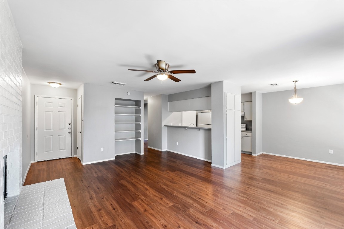 4304 Acropolis Court, Unit B Austin, TX 78759 - Photo 4 of 22 a view of empty room with wooden floor and window