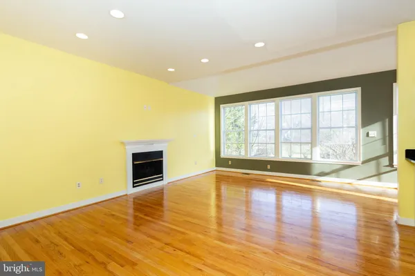 a kitchen with stainless steel appliances granite countertop a sink a stove and a microwave