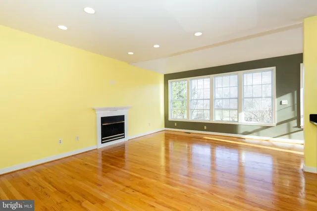 a kitchen with stainless steel appliances granite countertop a sink a stove and a microwave