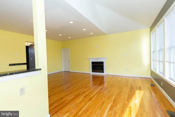 a kitchen with stainless steel appliances kitchen island granite countertop a stove a sink and a microwave