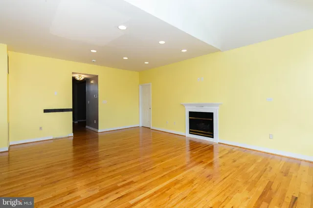 a bathroom with a granite countertop toilet and a shower