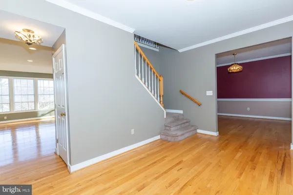 a view of an entryway with wooden floor