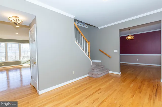 a view of an entryway with wooden floor
