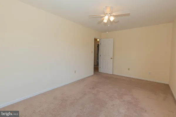 a living room with furniture and a chair