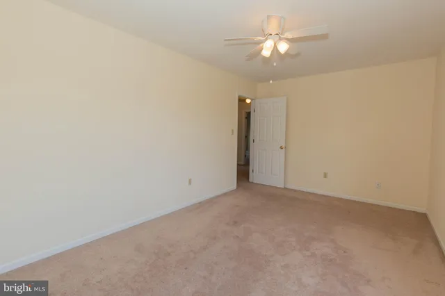 a living room with furniture and a chair