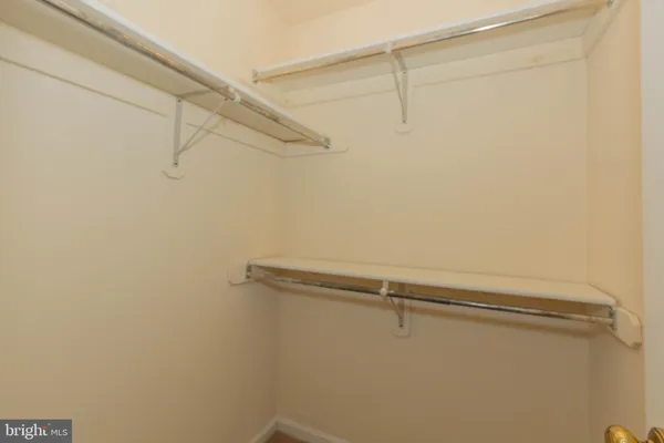 a view of livingroom with furniture and a fan