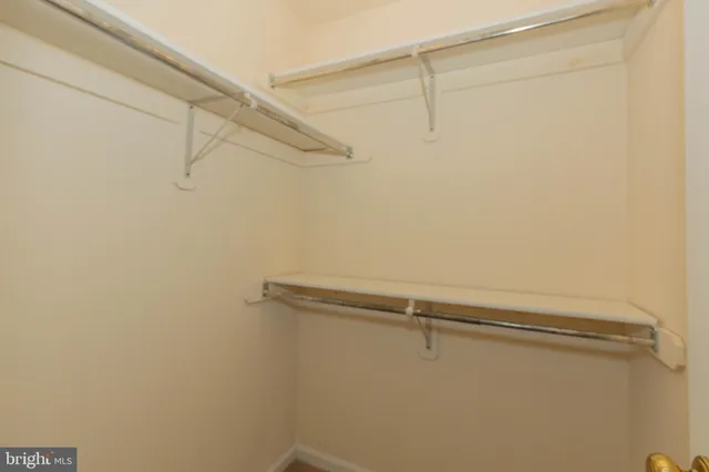 a view of livingroom with furniture and a fan