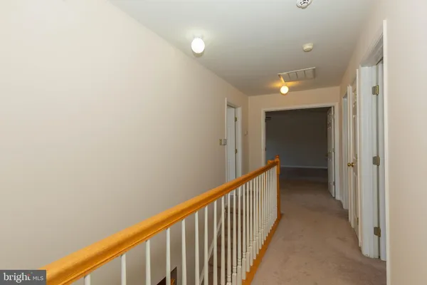 a spacious bedroom with a bed and a table