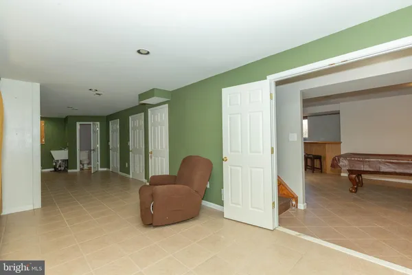 a view of a livingroom with furniture and a window