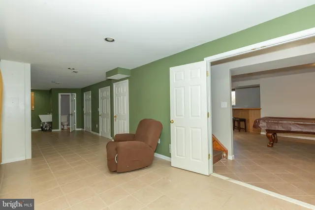 a view of a livingroom with furniture and a window