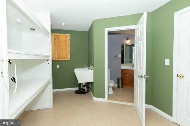 a bathroom with a sink a vanity and a mirror