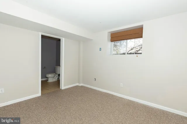 a view of a house with wooden deck