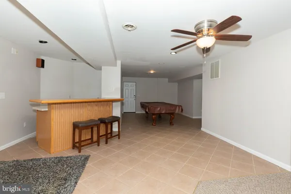 a view of balcony with wooden floor and fence