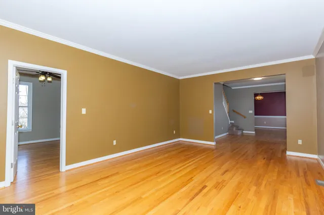 a front view of a house with a large window