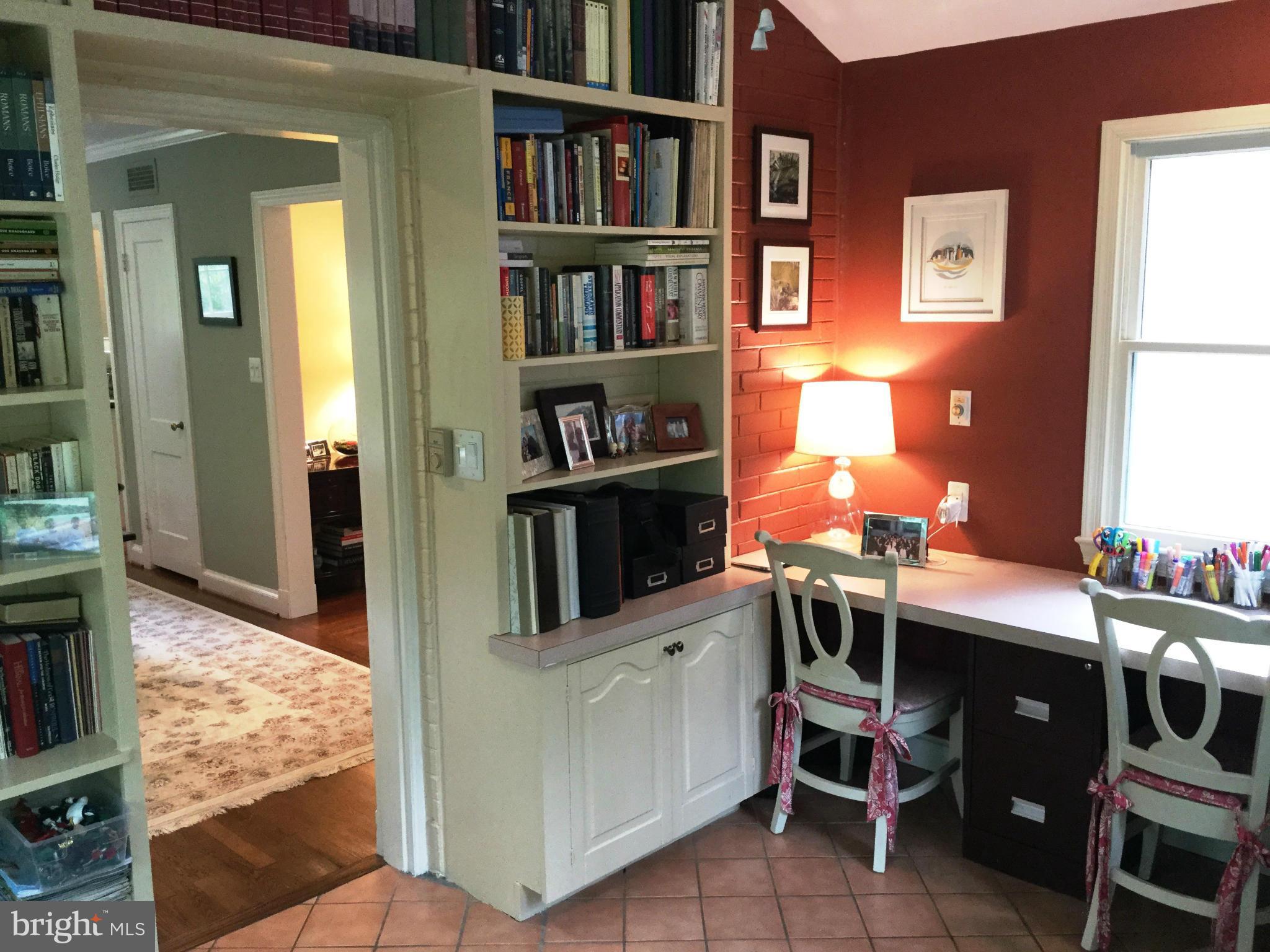6112 Wynnwood Road Bethesda, MD 20816 - Photo 14 of 28 Den on Main level; bookshelves and exit to patio