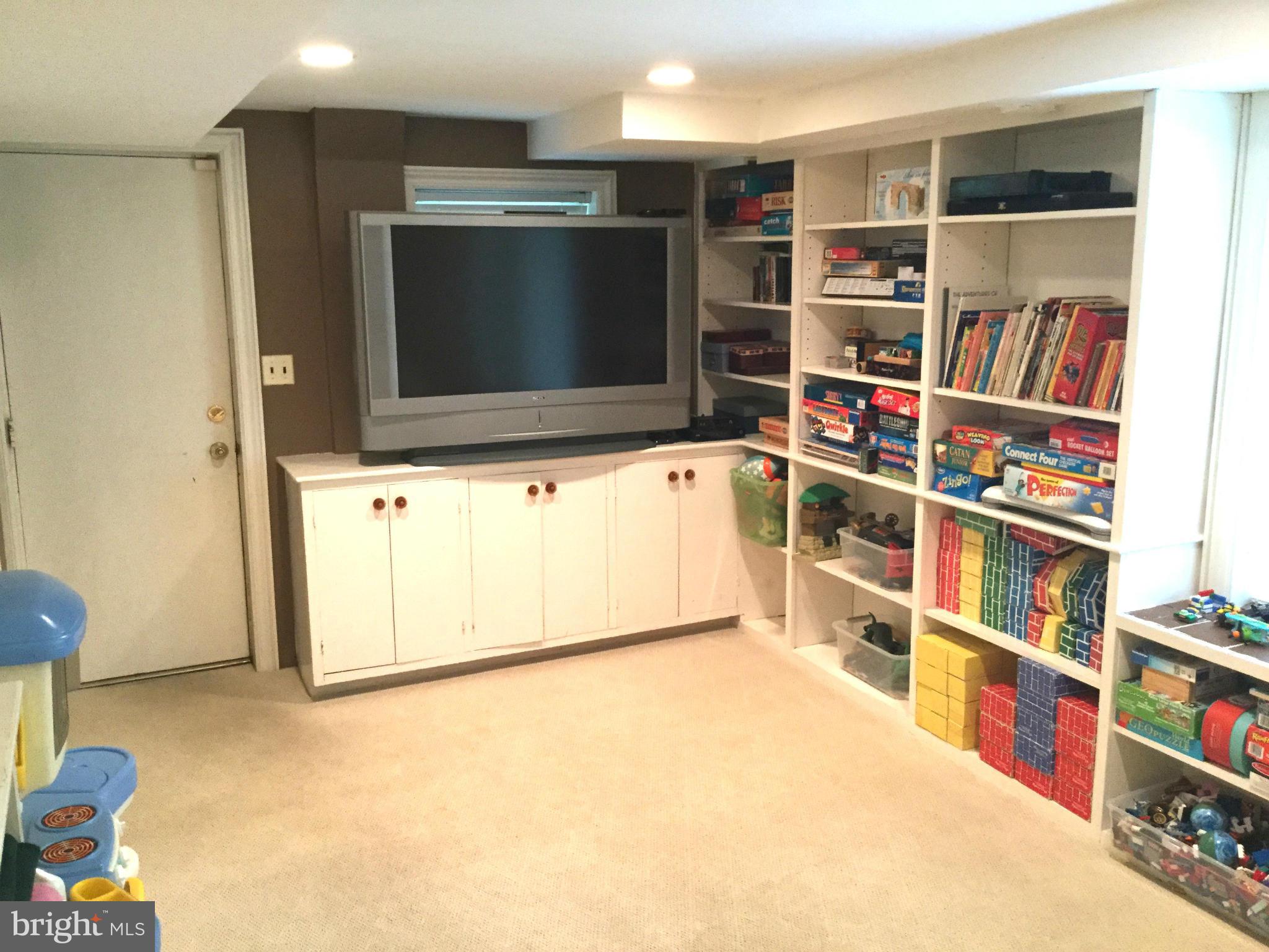 6112 Wynnwood Road Bethesda, MD 20816 - Photo 24 of 28 Rec Room, lower level, door to garage.