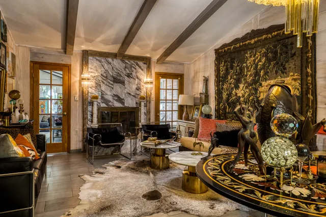 a view of a chairs and table in a living room