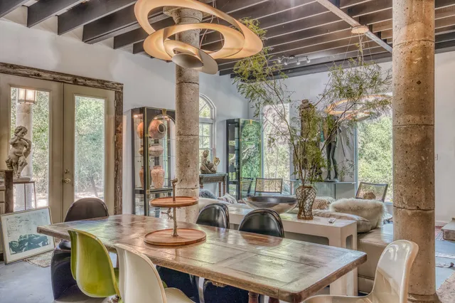 a view of a dining room with furniture window and outside view