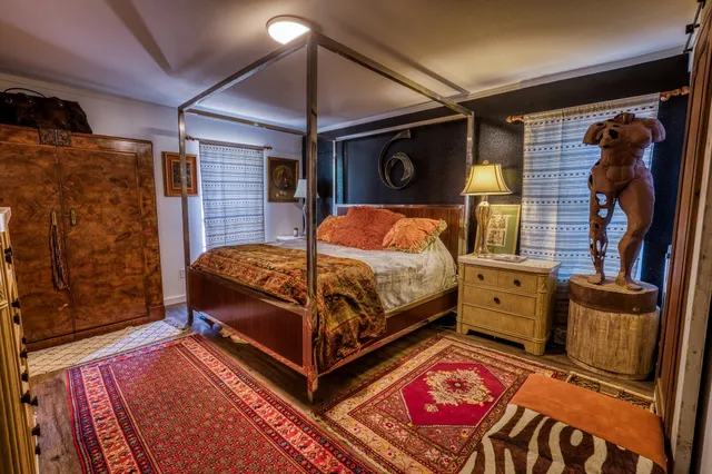 a bedroom with a bed and furniture