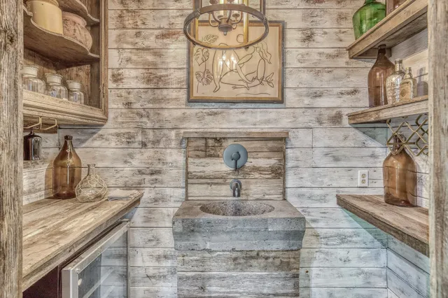 a kitchen with a sink and cabinets