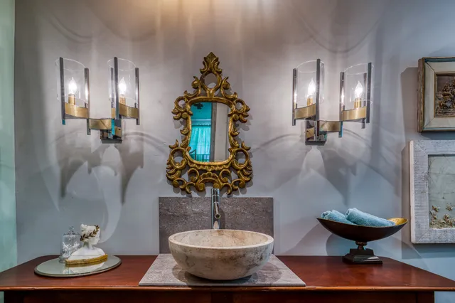 a living room with fireplace furniture and a window