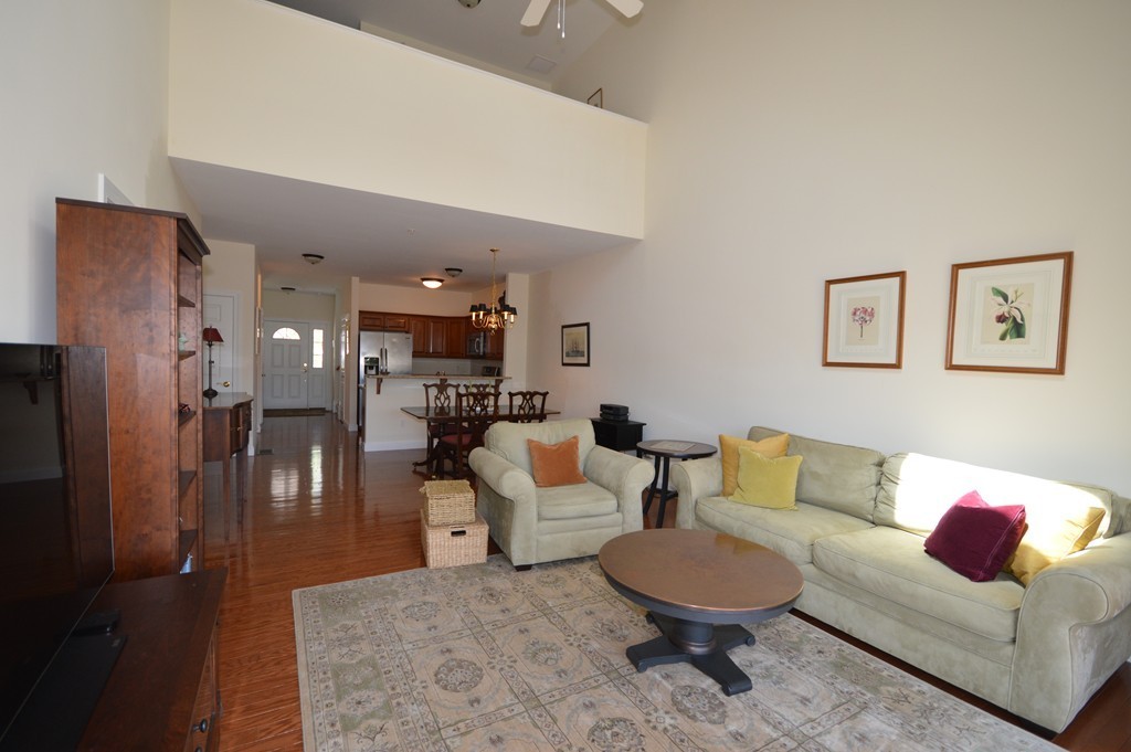 704 Autumn Ridge Drive, Unit 704 Ayer, MA 01432 - Photo 13 of 30 a living room with furniture and a couch