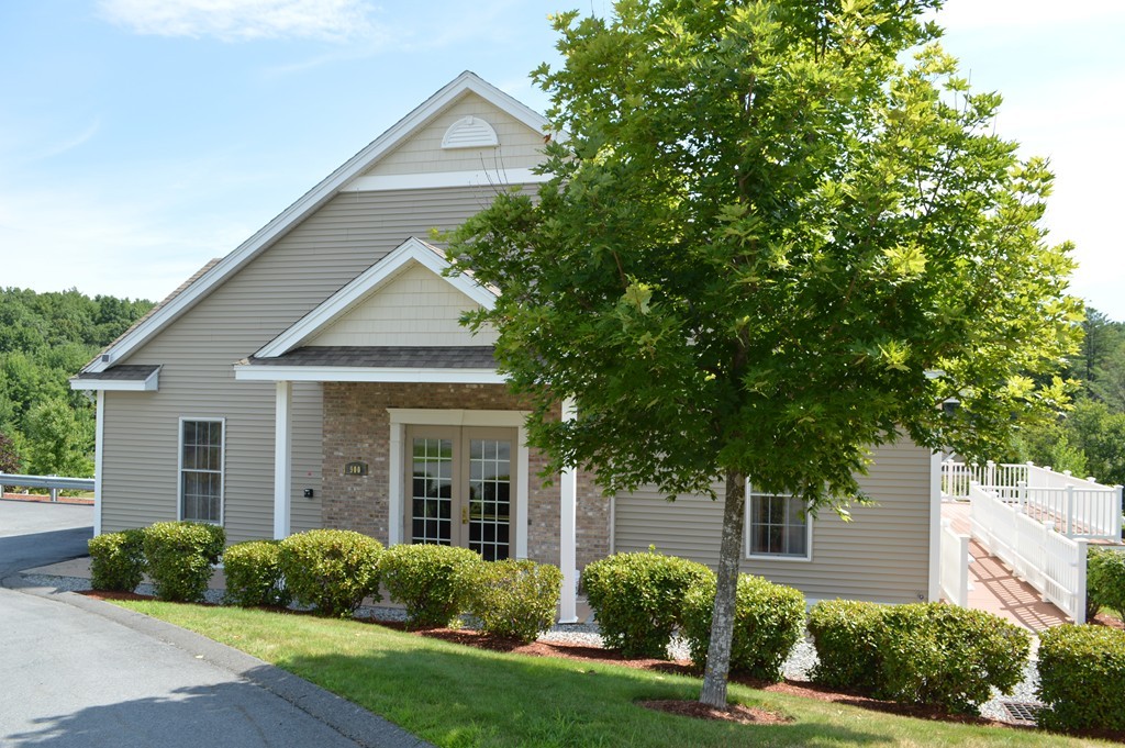 704 Autumn Ridge Drive, Unit 704 Ayer, MA 01432 - Photo 20 of 30 front view of a house and a yard