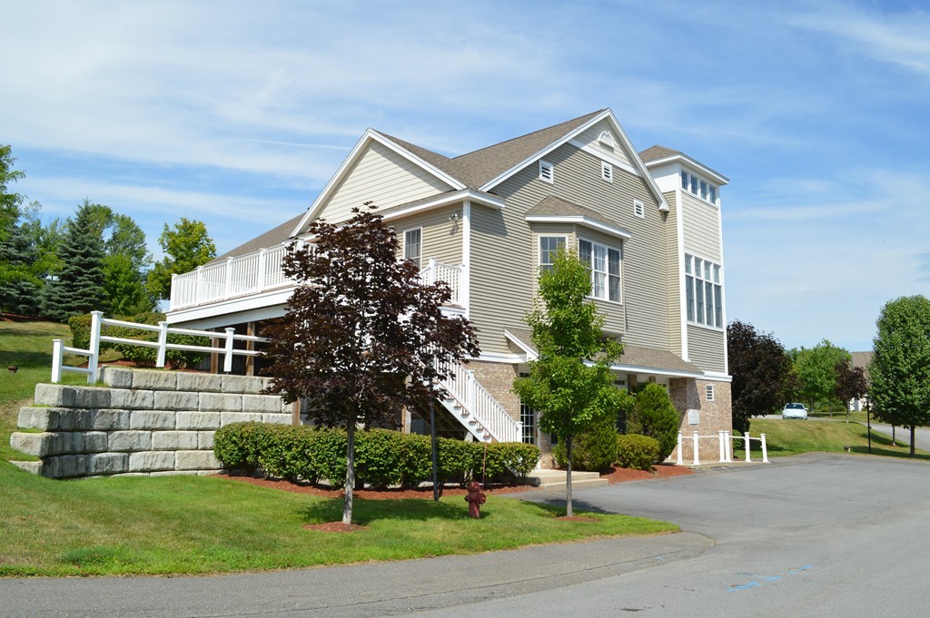 704 Autumn Ridge Drive, Unit 704 Ayer, MA 01432 - Photo 21 of 30 front view of house with a yard