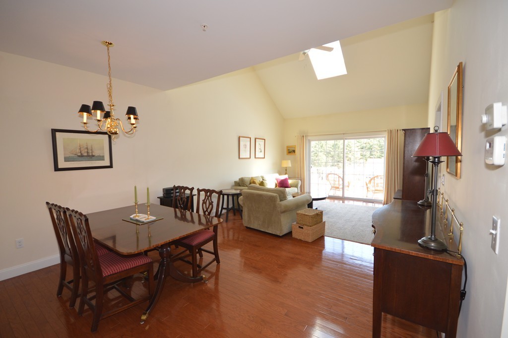 704 Autumn Ridge Drive, Unit 704 Ayer, MA 01432 - Photo 10 of 30 a view of a livingroom with furniture and a table