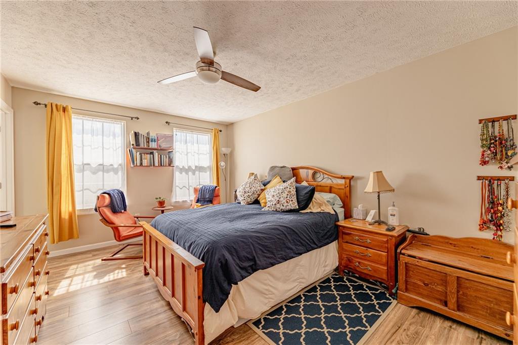 120 Lockheed Drive Coraopolis, PA 15108 - Photo 14 of 31 a bedroom with a bed and wooden floor