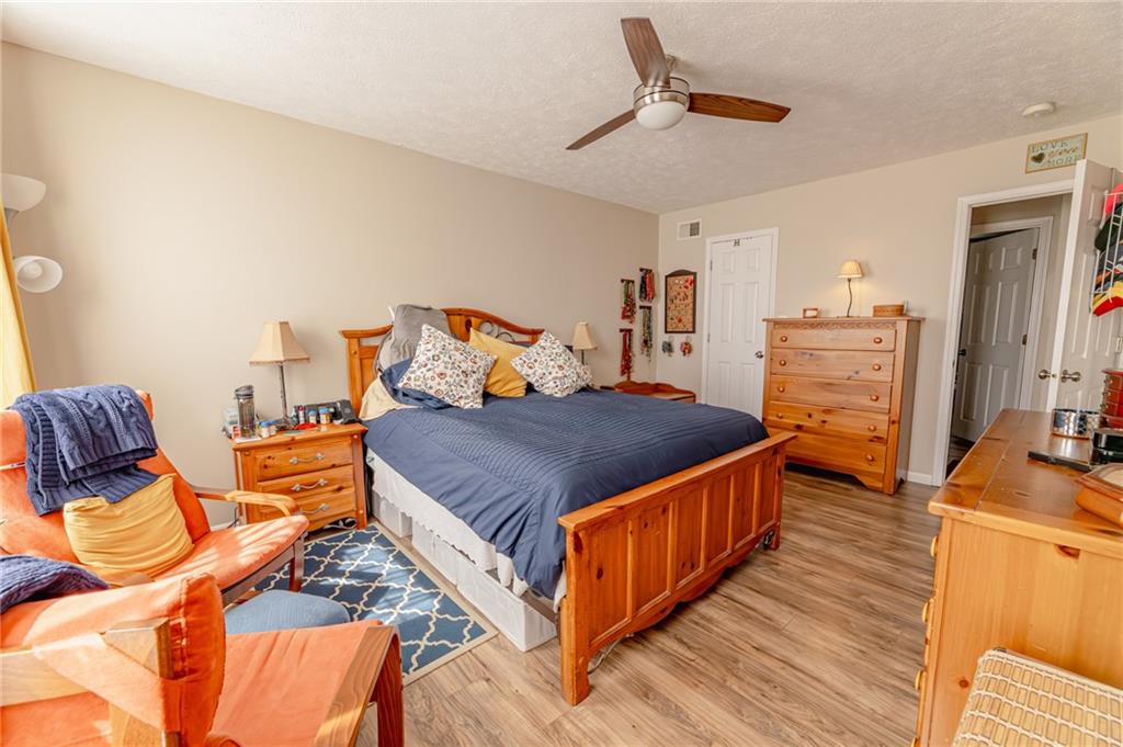 120 Lockheed Drive Coraopolis, PA 15108 - Photo 15 of 31 a bedroom with a bed and wooden floor