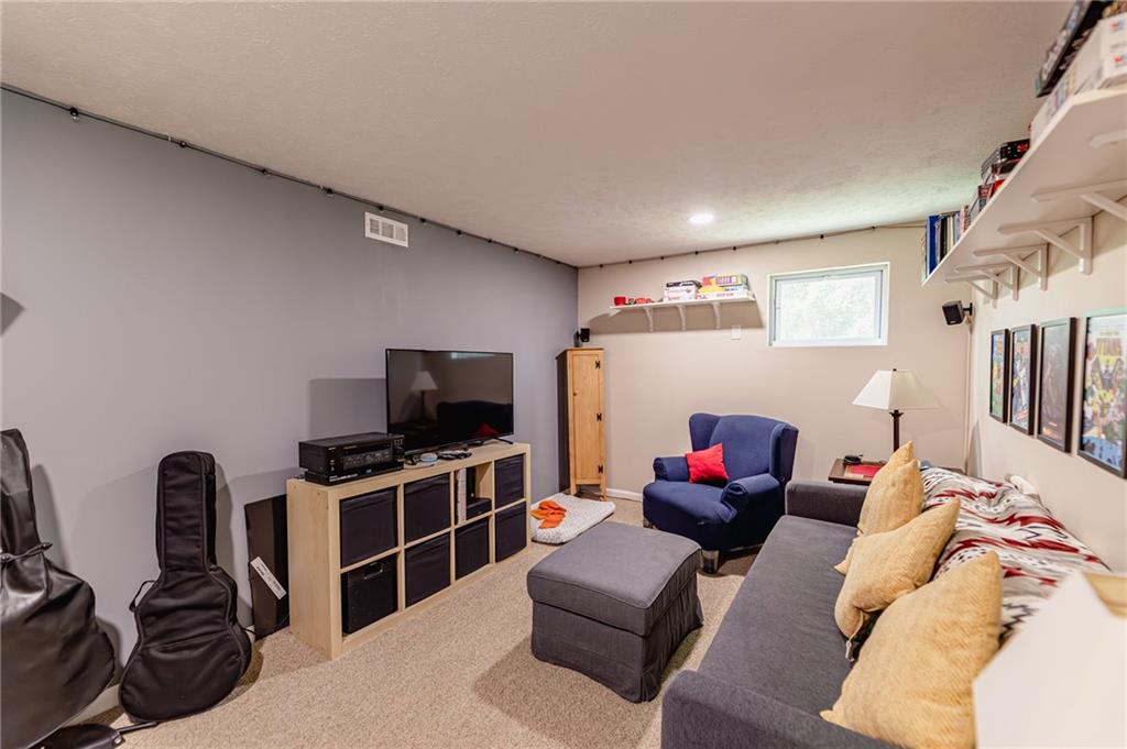 120 Lockheed Drive Coraopolis, PA 15108 - Photo 25 of 31 a living room with furniture and a flat screen tv