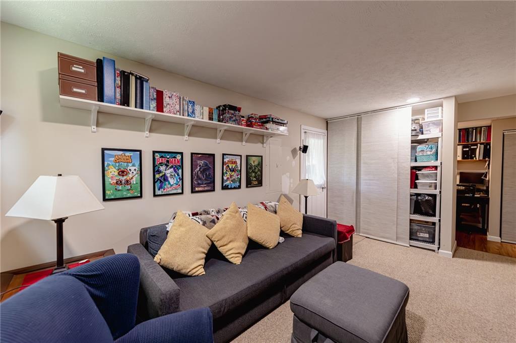 120 Lockheed Drive Coraopolis, PA 15108 - Photo 26 of 31 a living room with furniture and a book shelf