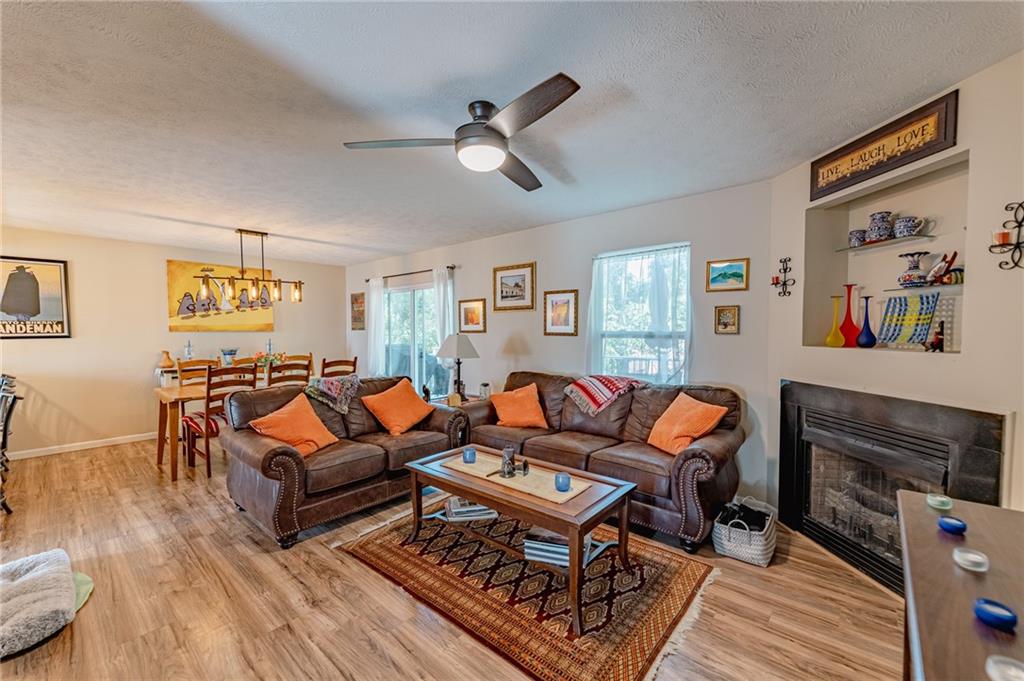 120 Lockheed Drive Coraopolis, PA 15108 - Photo 9 of 31 a living room with furniture a flat screen tv and a fireplace