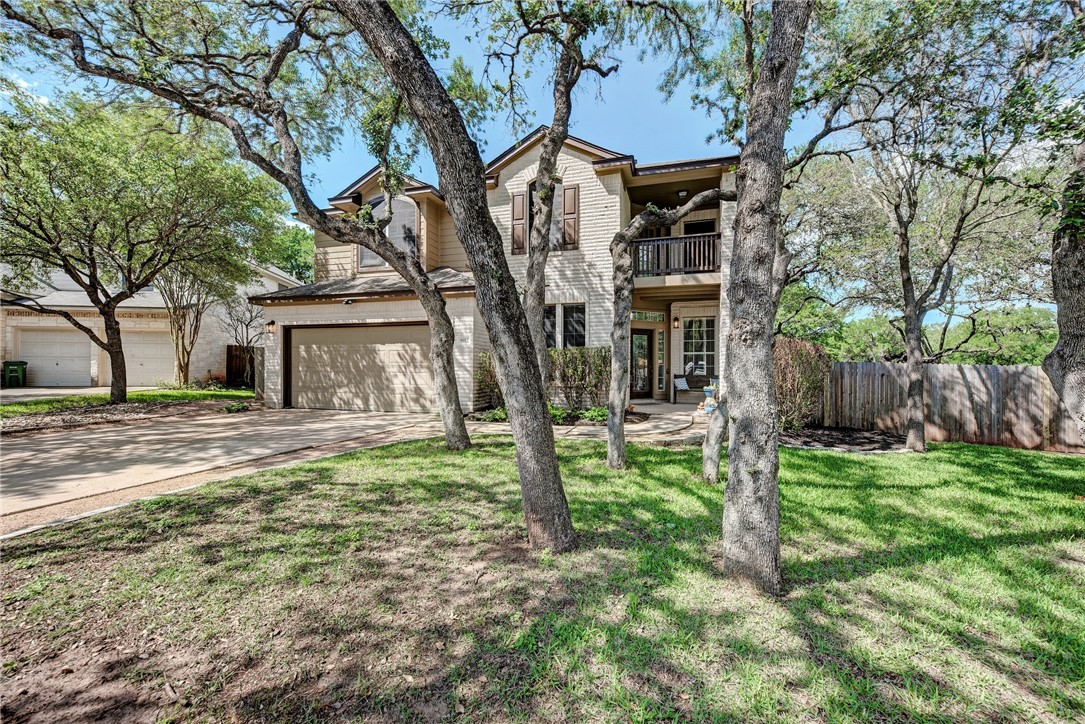 a house that has a tree in front of it
